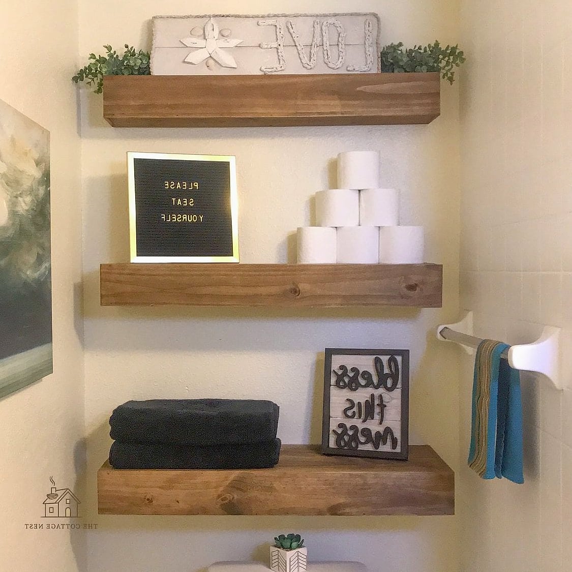 25 Creative Over The Toilet Storage Ideas That Will Inspire You 4 Floating Shelves in a Staggered Layout