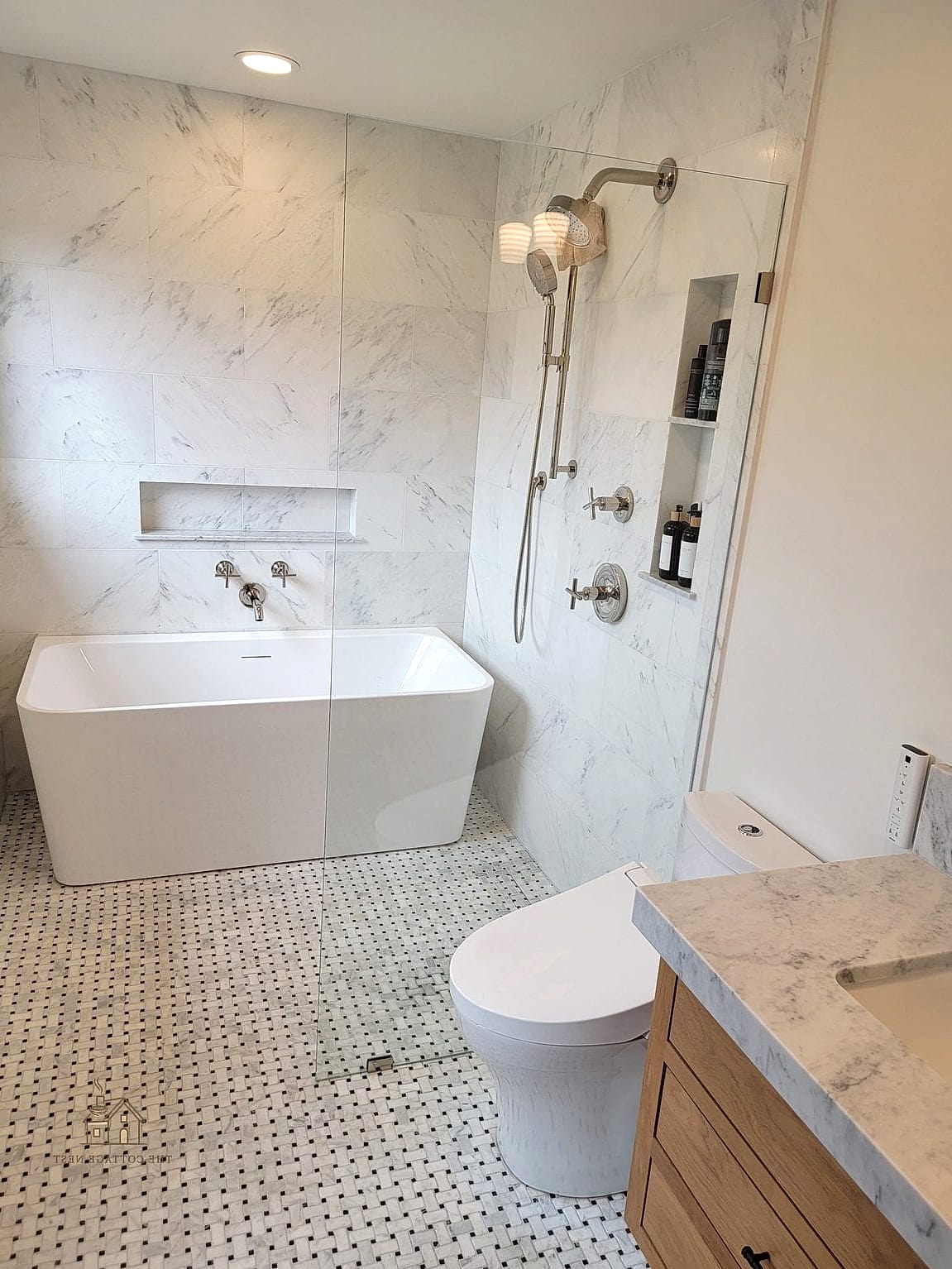 Freestanding Tub Nestled Inside a Glass-Walled Shower