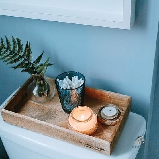 35 Chic Back Of Toilet Decor Ideas for a Beautiful Home 9 Layered Candles and Trays