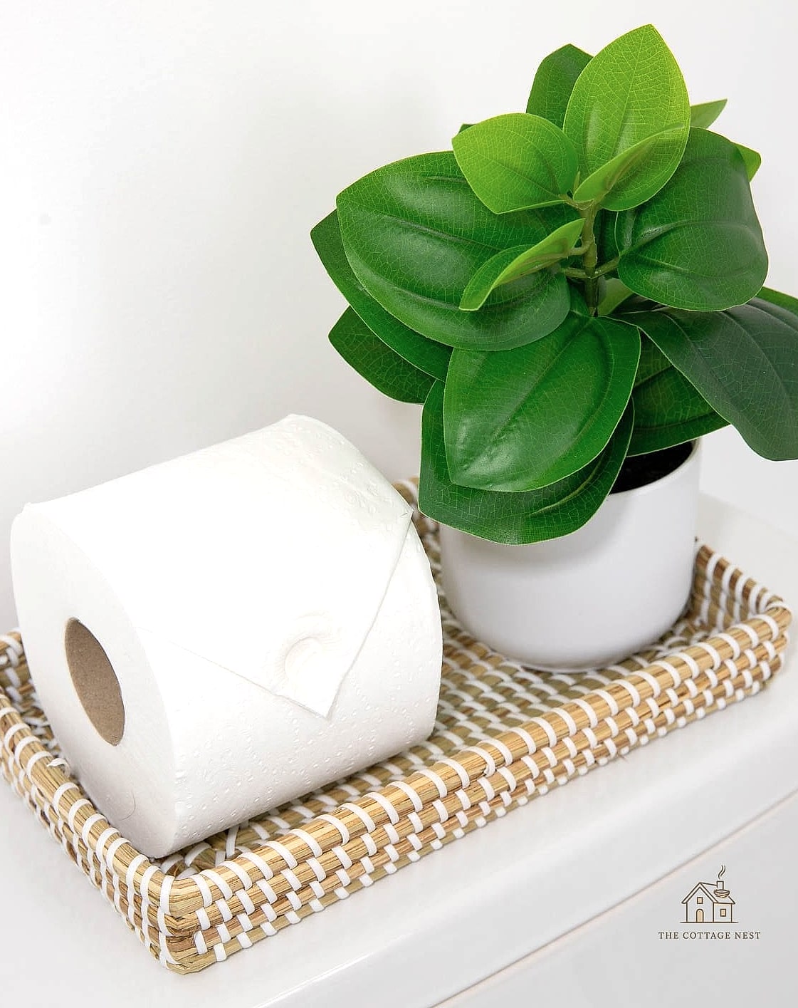 15 Stunning Toilet Tank Decor Ideas You'll Absolutely Love 14 Layered Textiles with a Folded Hand Towel