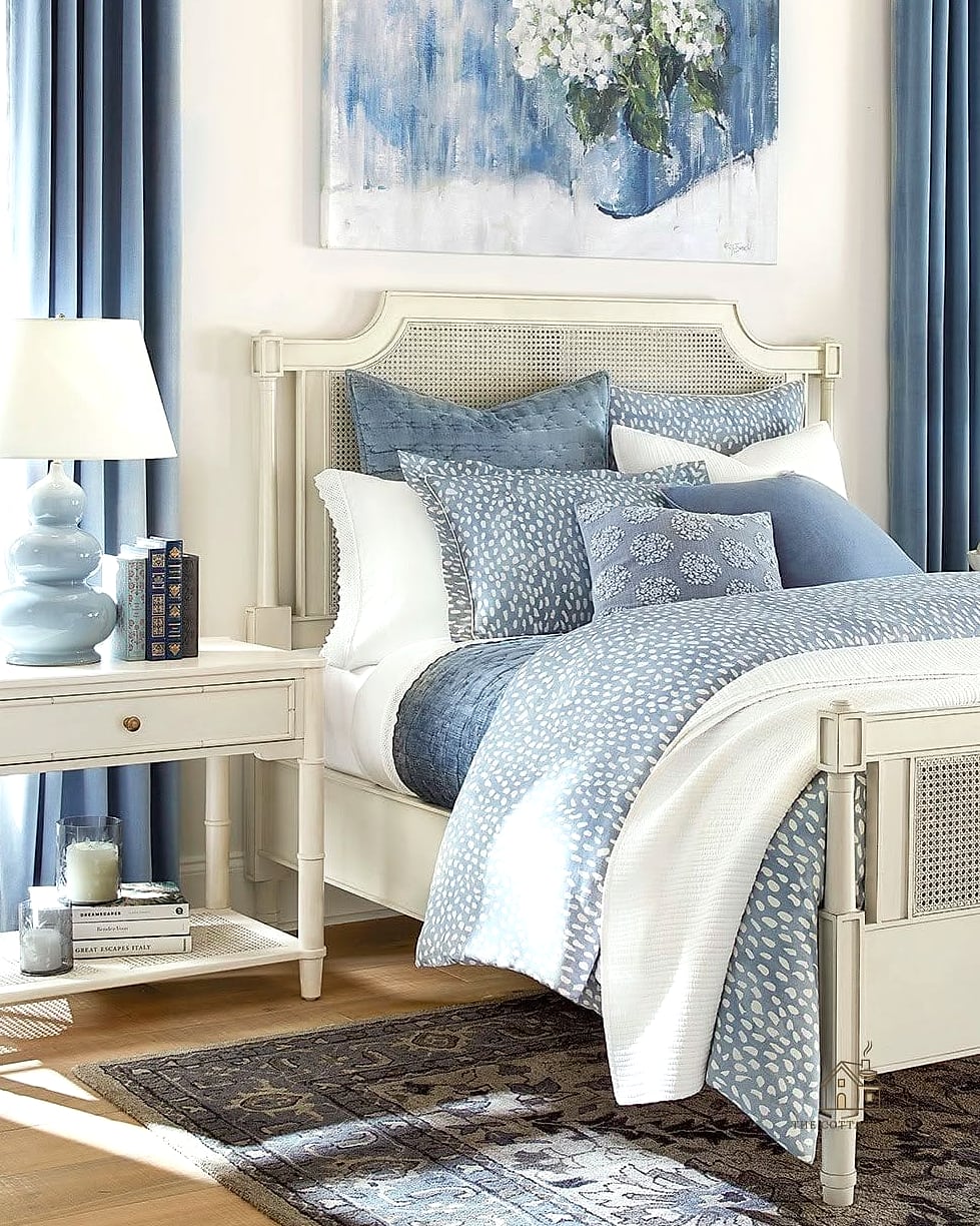 Layered White Bedding with Blue Throw