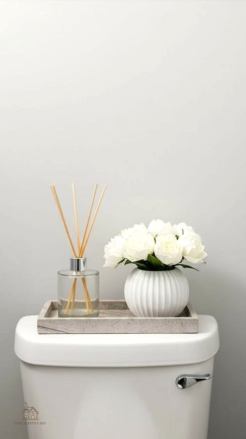 15 Stunning Toilet Tank Decor Ideas You'll Absolutely Love 12 A Reed Diffuser Instead of a Candle