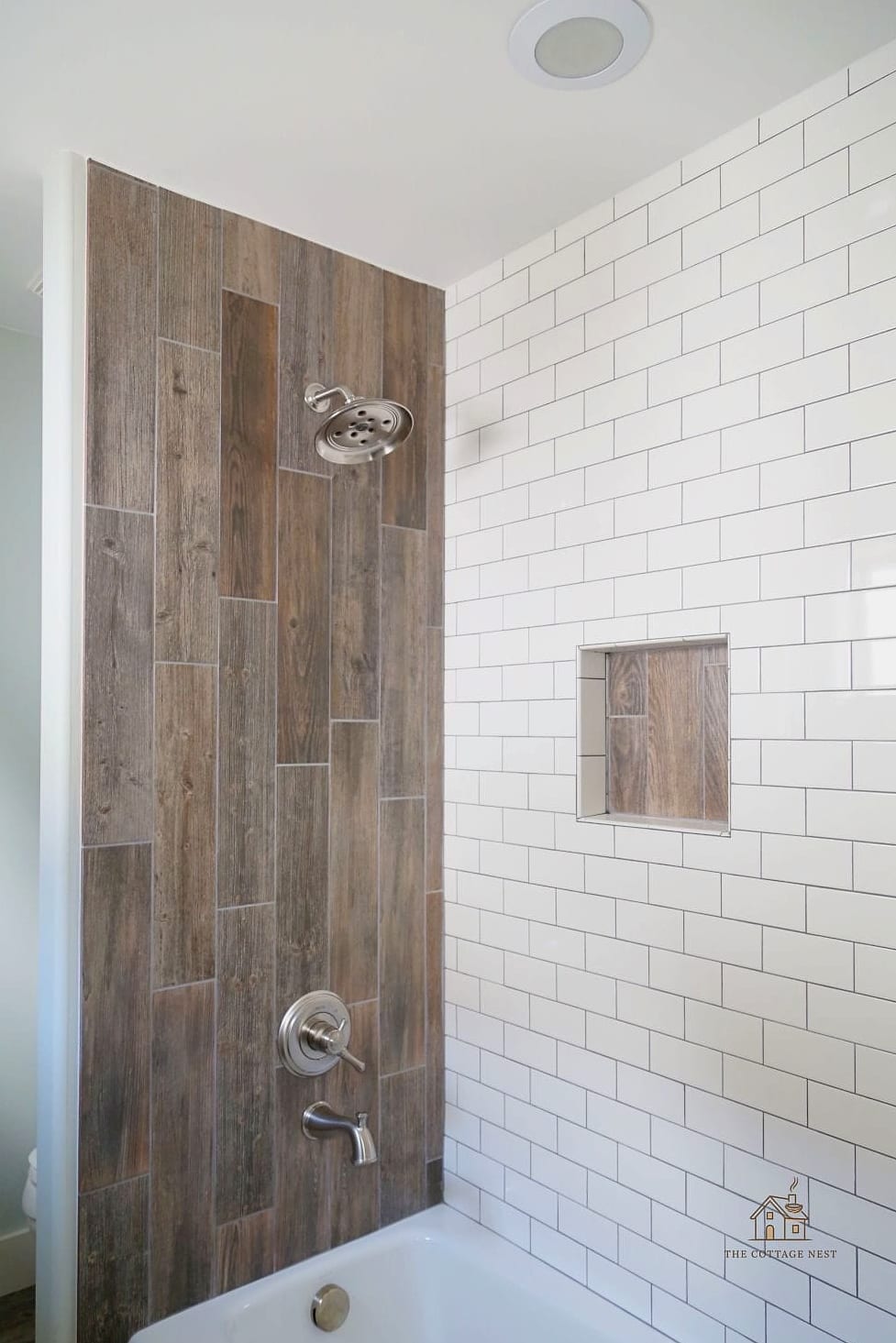 21 Clever Wood Tile Shower Ideas for Every Style 10 Wood Tile Shower Floor with Pebble Border