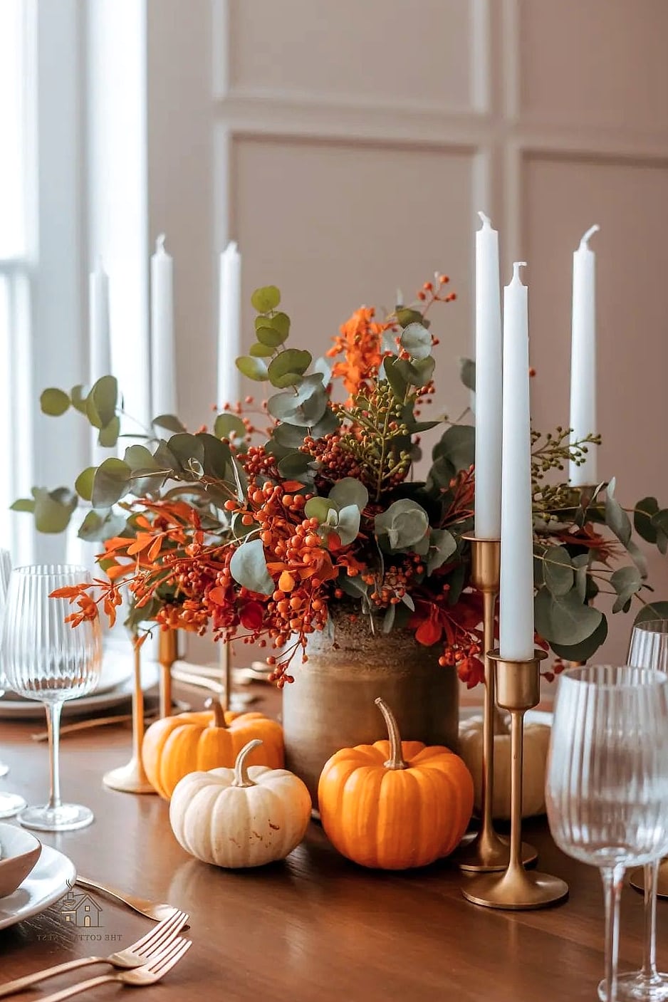 35 Beautiful Fall Table Centerpiece Ideas to Wow Your Guests 10 Antique Brass Candelabra with Trailing Greenery