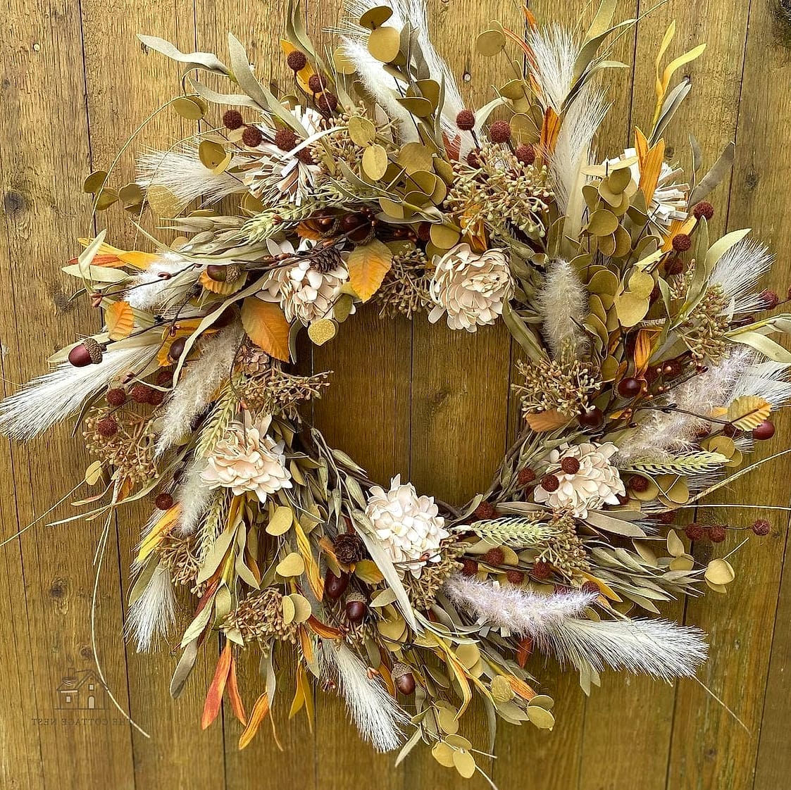 20 Dreamy Fall Wreaths For Front Door to Try This Season 11 Boho Feather and Foliage Wreath