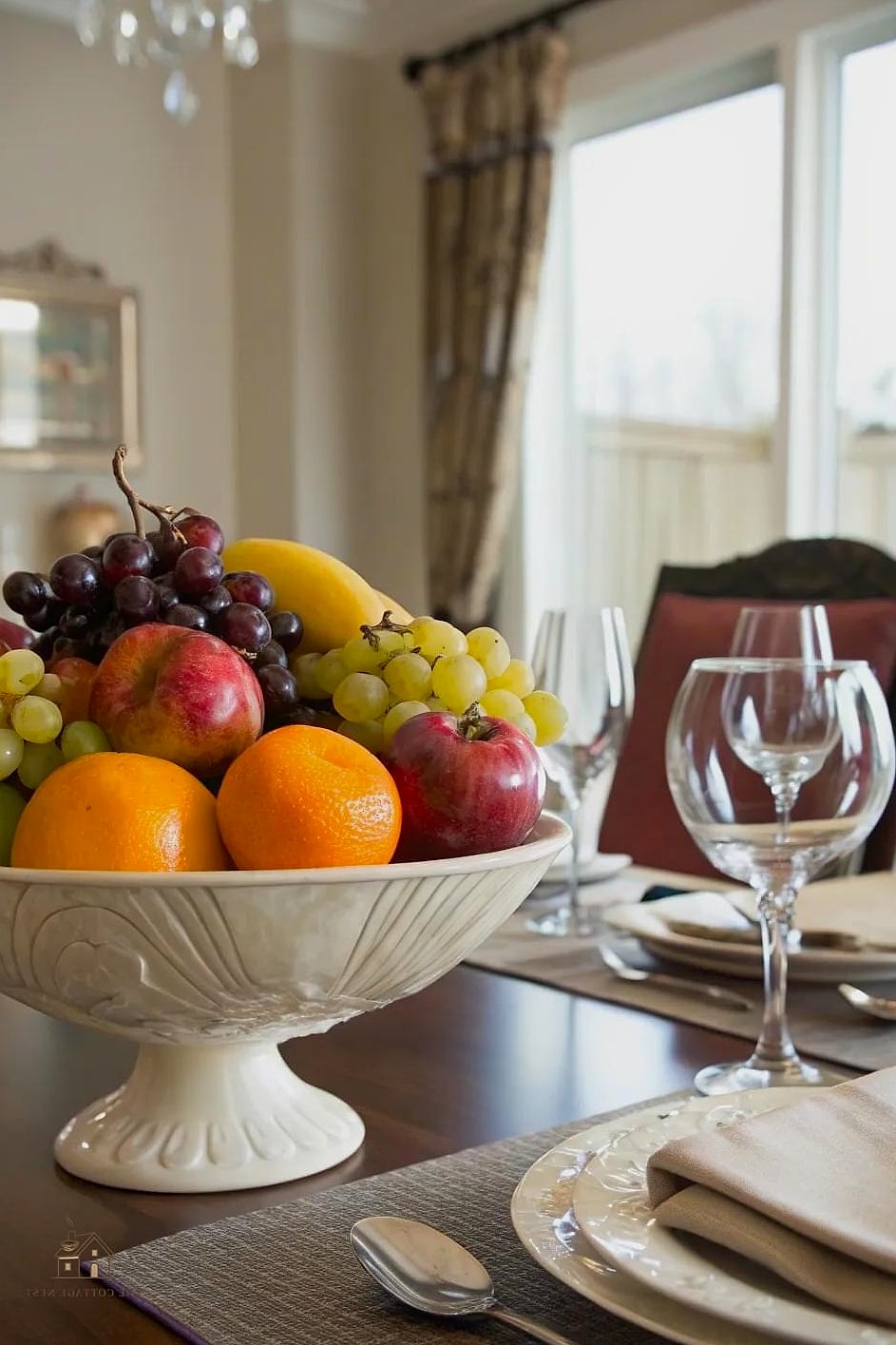 45 Brilliant Dining Room Table Centerpiece Ideas to Copy Right Now 18 A Ceramic Fruit Bowl with Textural Accents