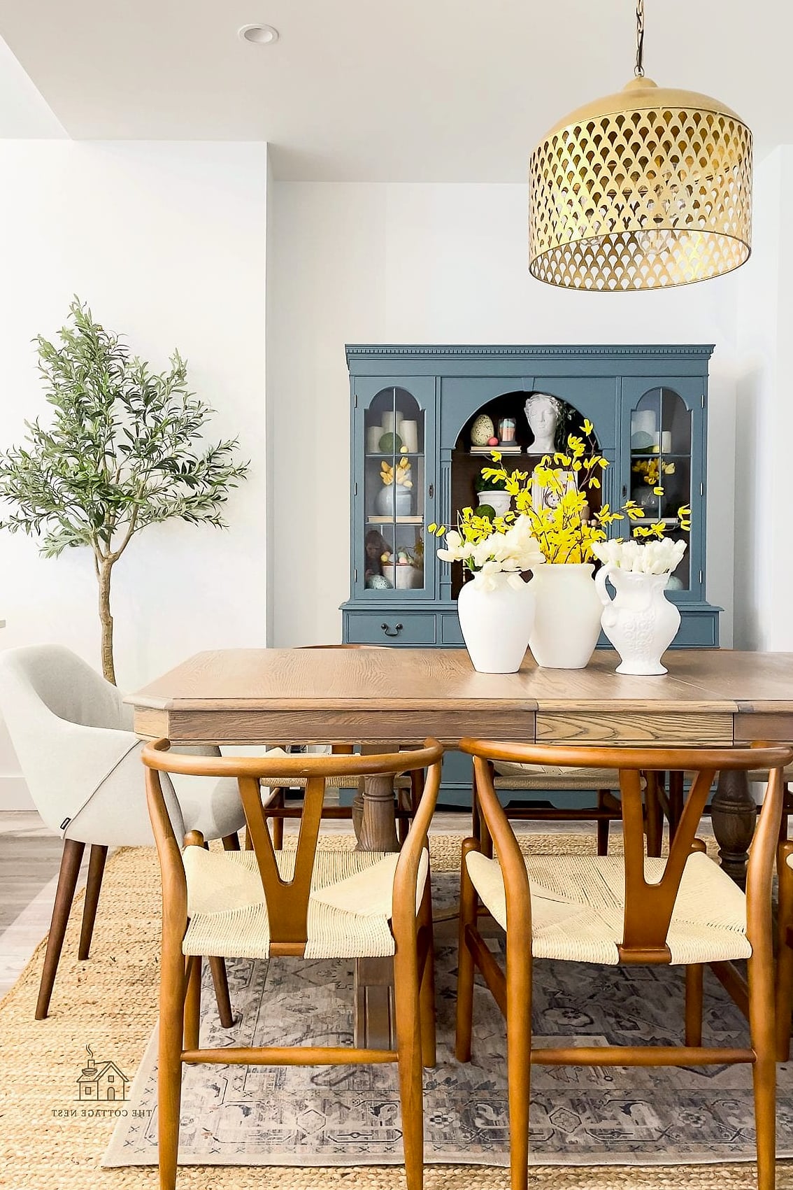 45 Brilliant Dining Room Table Centerpiece Ideas to Copy Right Now 41 A Ceramic Vase in a Bold Color