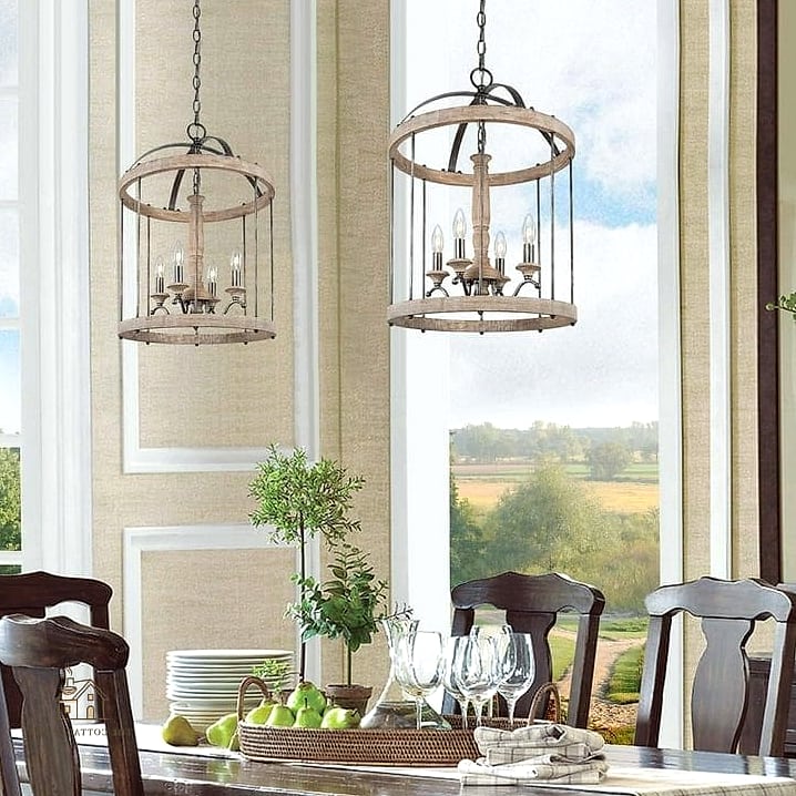 45 Brilliant Farmhouse Dining Room Lighting Ideas to Copy Right Now 31 Chandelier with Farmhouse-Style Cage Shades