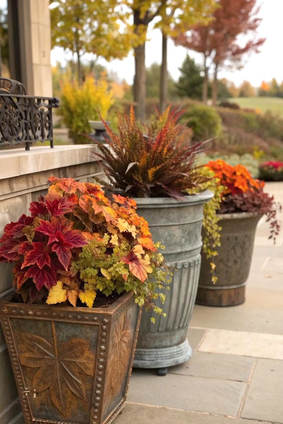 15 Brilliant Fall Outdoor Planter Ideas to Copy Right Now 9 Copper Planters with Warm Marigolds