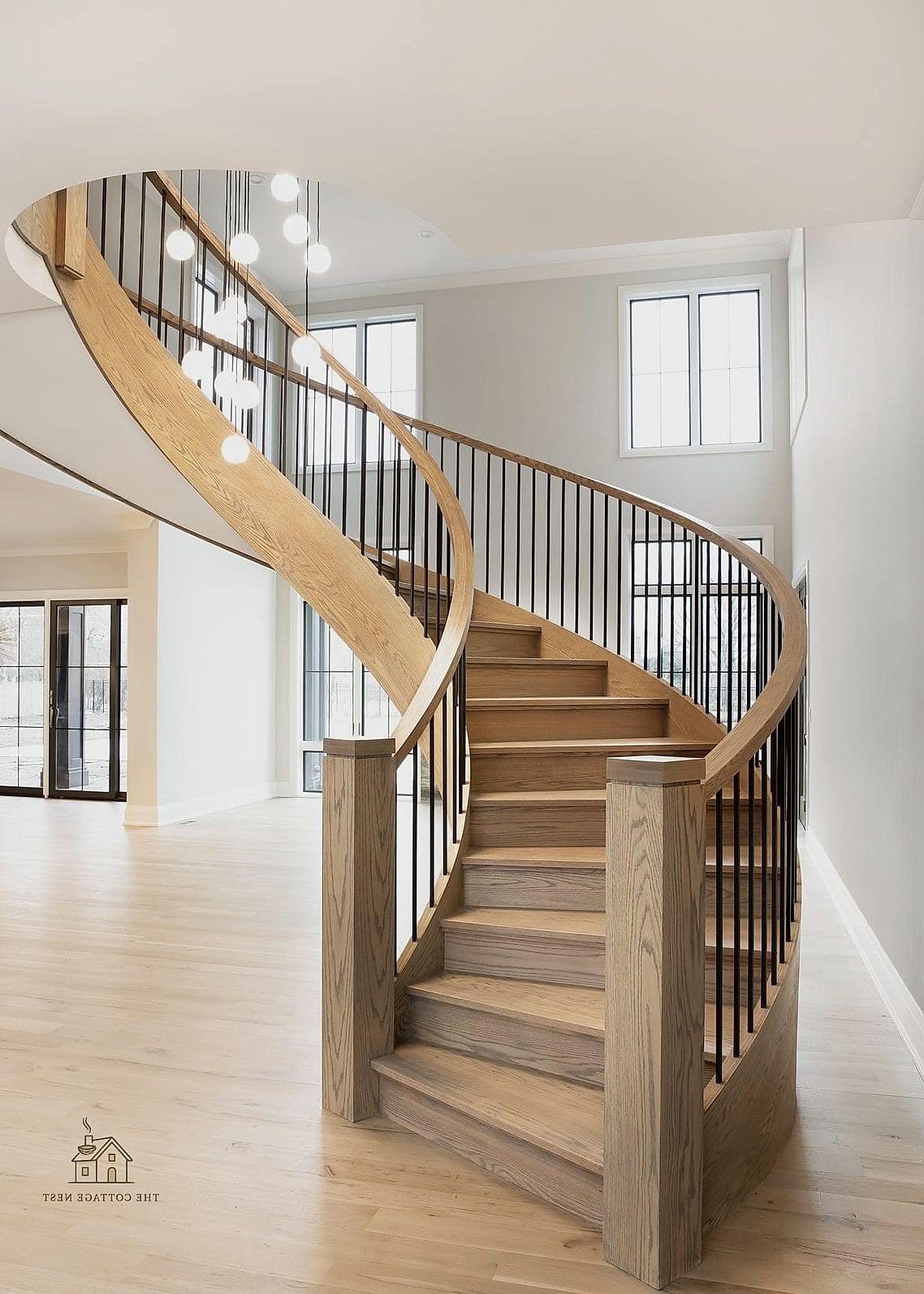 45 Stunning Stair Railing Ideas You'll Absolutely Love 9 Curved Staircase with Custom Iron Rail