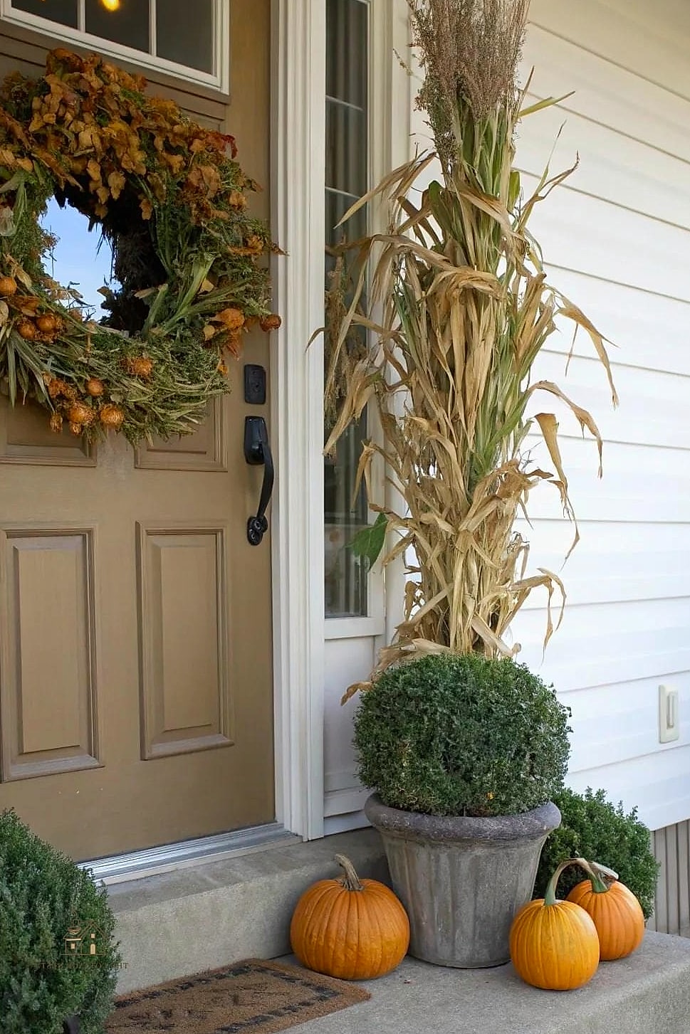 45 Gorgeous Fall Front Porch Decor Ideas That Are Totally Doable 39 A DIY Topiary Pumpkin Wreath