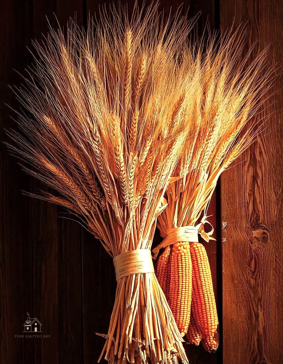 30 Dreamy Farmhouse Fall Decor Ideas to Try This Season 5 Dried Wheat Bundles on the Mantel