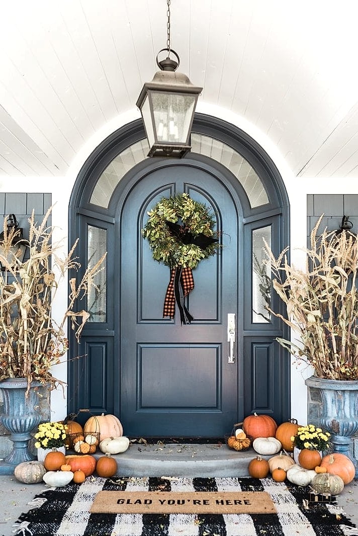 45 Gorgeous Fall Front Porch Decor Ideas That Are Totally Doable 43 A Fall-Themed Welcome Mat with a Pun