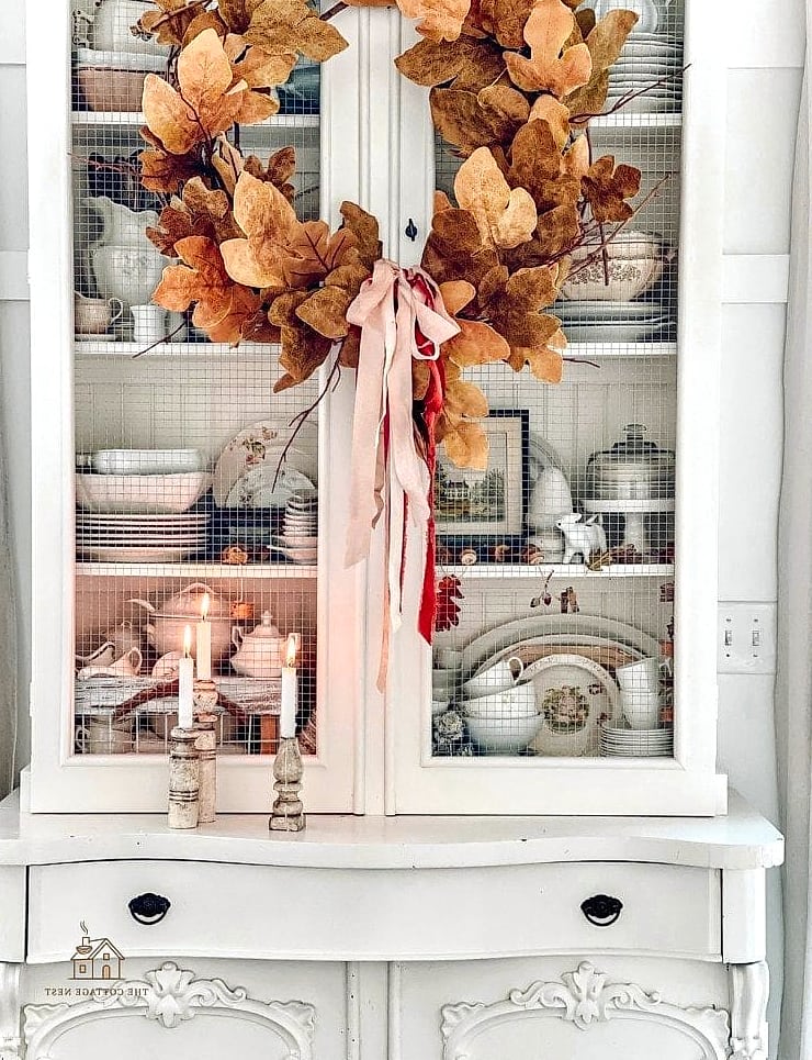 30 Dreamy Fall Hutch Decor Ideas to Try This Season 28 Faux Fall Wreath Leaned Inside