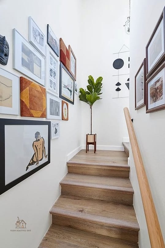35 Creative Stair Landing Decor Ideas That Will Inspire You 2 Gallery Wall Along the Staircase
