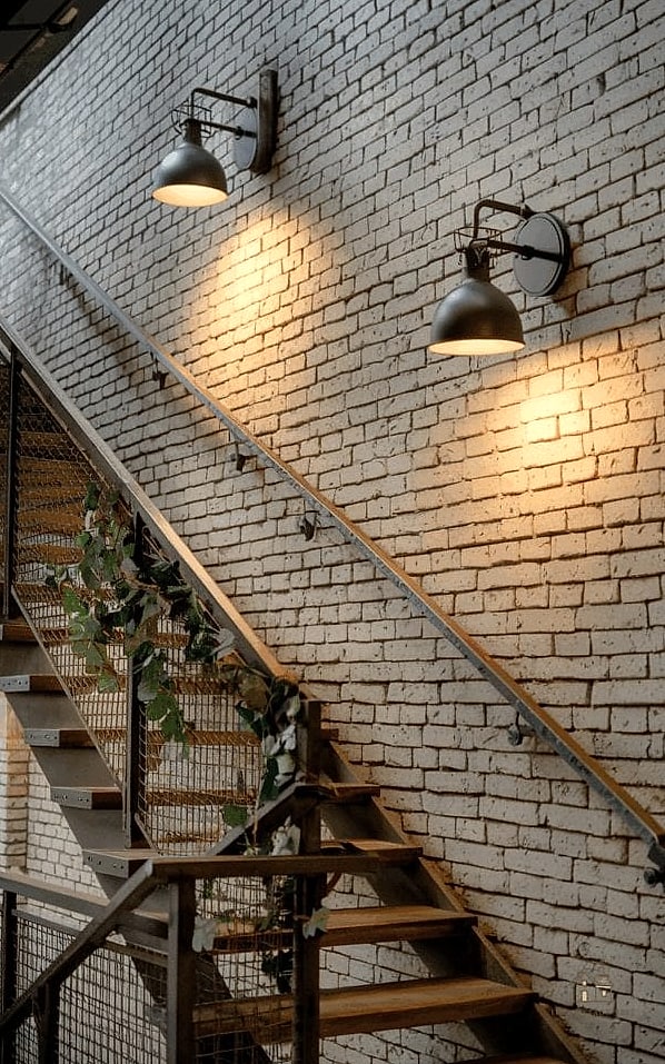 50 Clever Staircase Lighting Ideas for Every Style 15 Industrial Cage Pendants