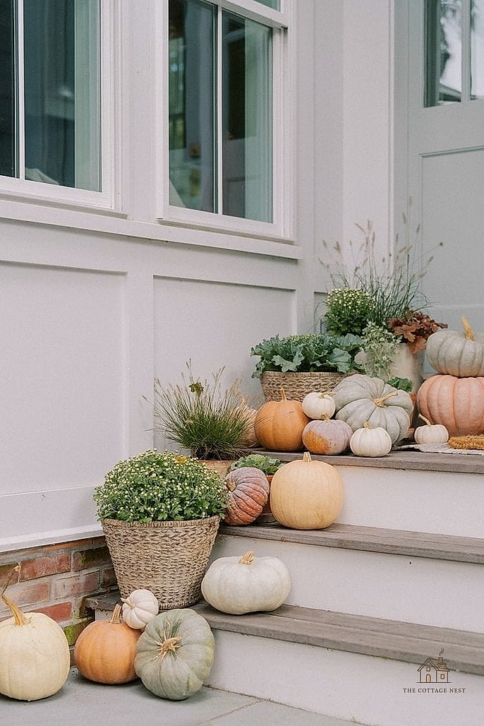 45 Gorgeous Fall Front Porch Decor Ideas That Are Totally Doable 44 Layered Greenery and Pumpkins in a Wagon