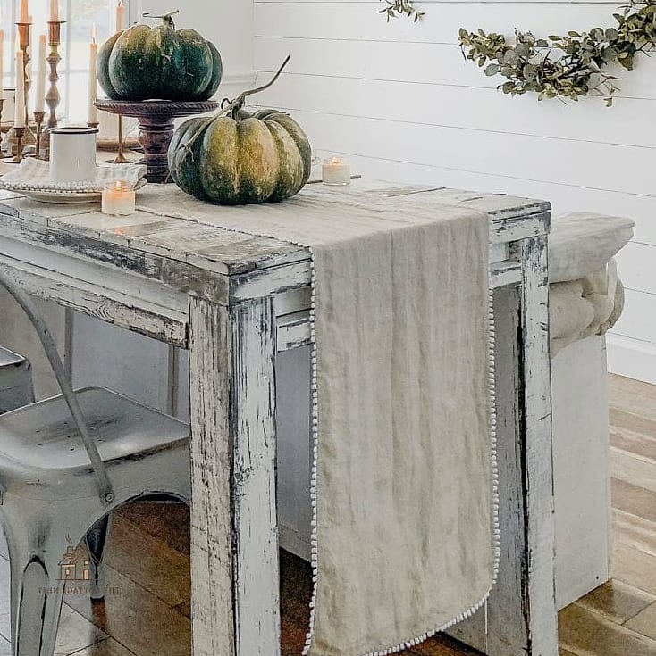 30 Dreamy Fall Hutch Decor Ideas to Try This Season 7 Layered Table Linens as Backdrop