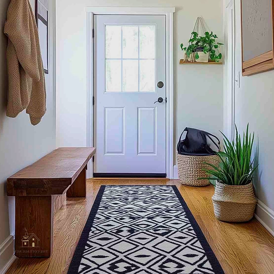 35 Brilliant Small Entryway Rug Ideas to Copy Right Now 8 Layered Two-Tone Rug Stack
