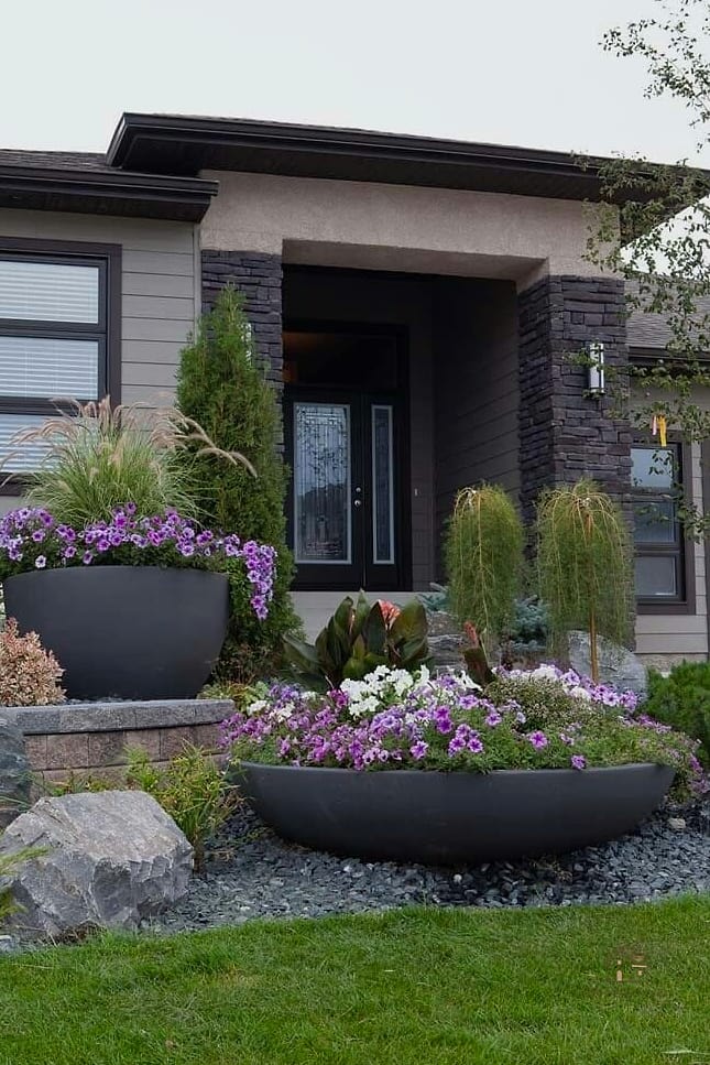 20 Cozy Driveway Landscaping Ideas Worth Pinning 13 A Mixed Container Garden Near the Entrance