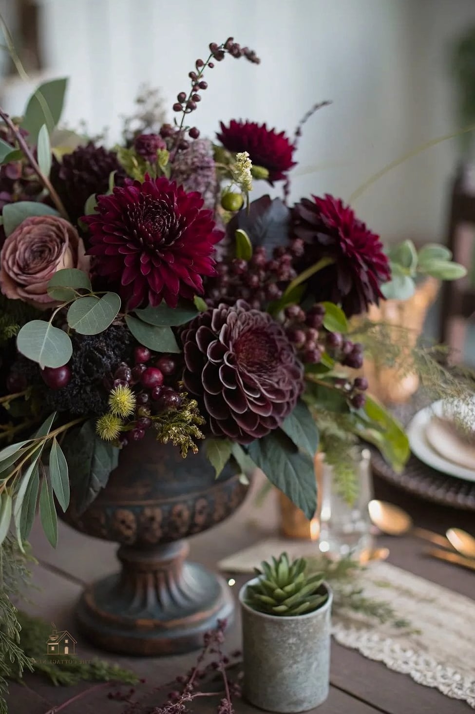 35 Beautiful Fall Table Centerpiece Ideas to Wow Your Guests 12 Moody Burgundy and Plum Floral Arrangement