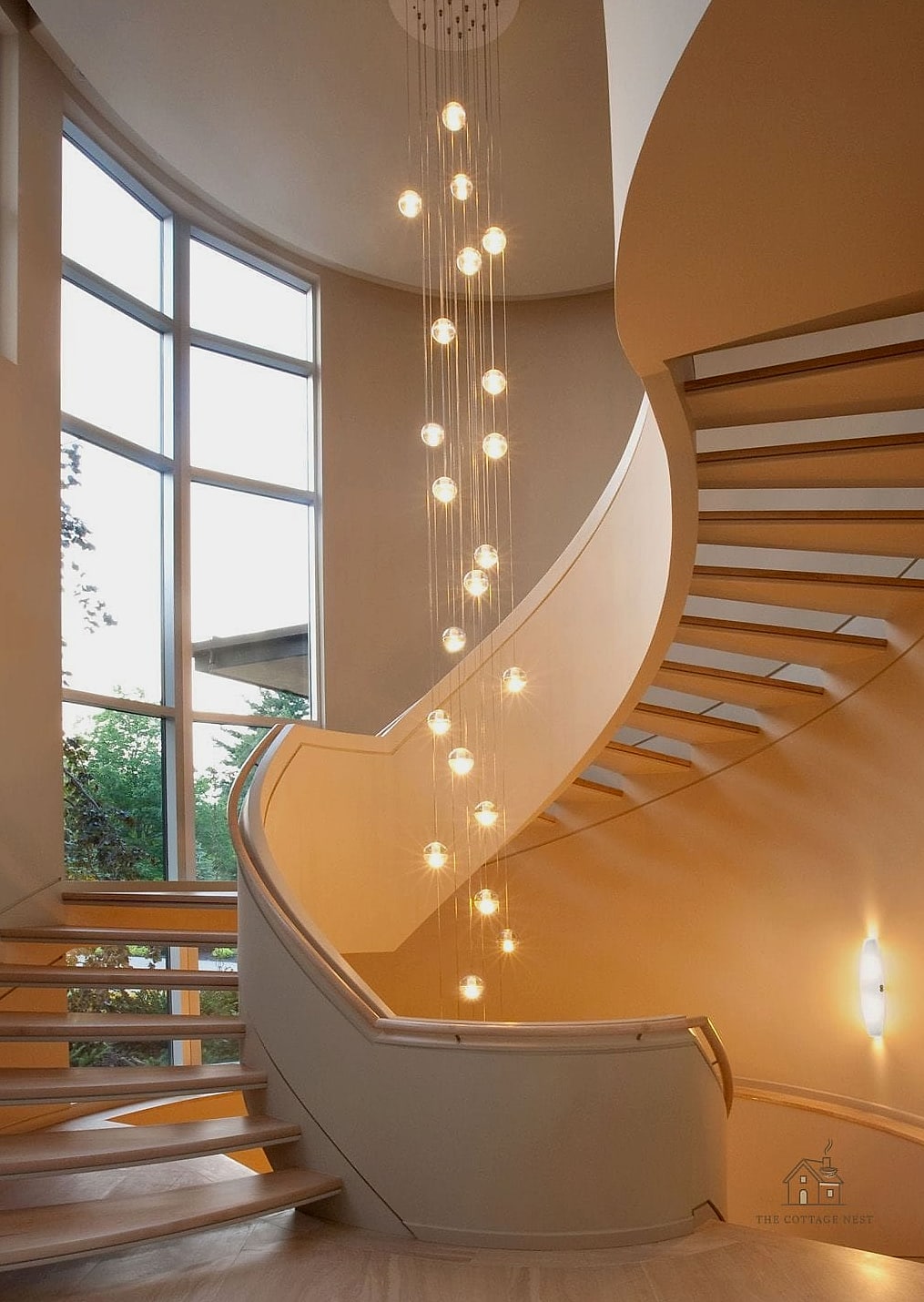 50 Clever Staircase Lighting Ideas for Every Style 41 Multi-Tier Chandelier for Two-Story Stairwells