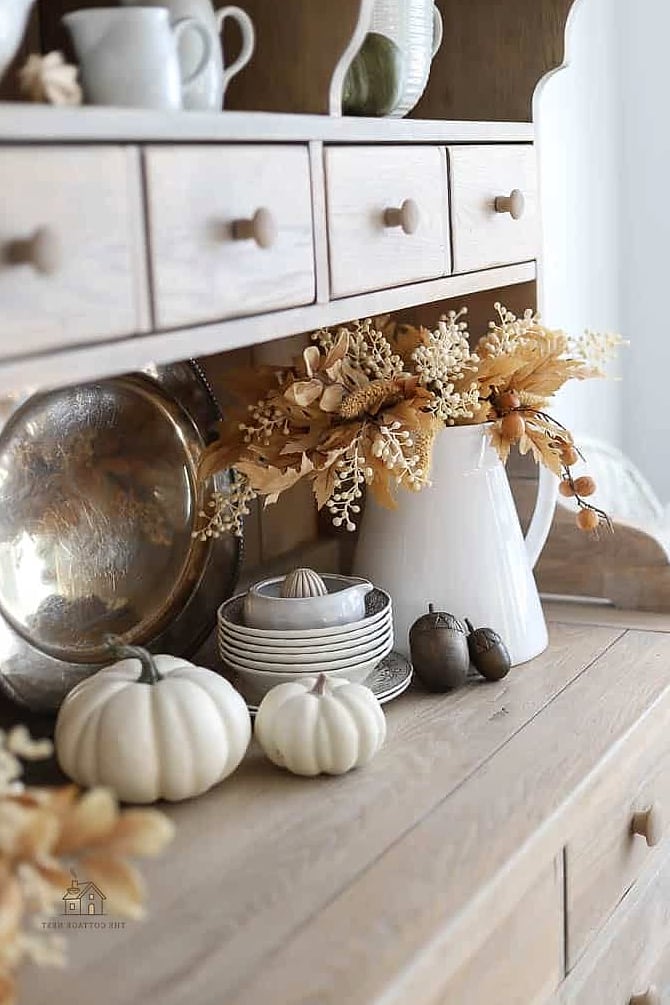 30 Dreamy Fall Hutch Decor Ideas to Try This Season 3 Neutral Stoneware and Ceramic Vignette