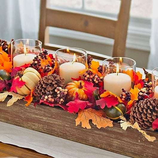 35 Beautiful Fall Table Centerpiece Ideas to Wow Your Guests 6 Pinecone and Cinnamon Stick Vase Filler