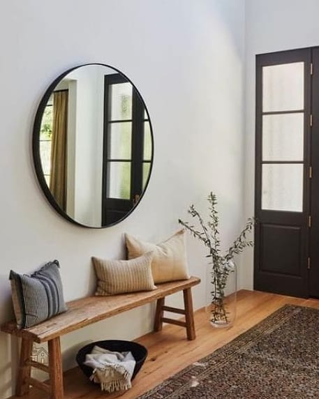 20 Cozy Apartment Entryway Ideas Worth Pinning 6 A Round Mirror to Open Up the Space