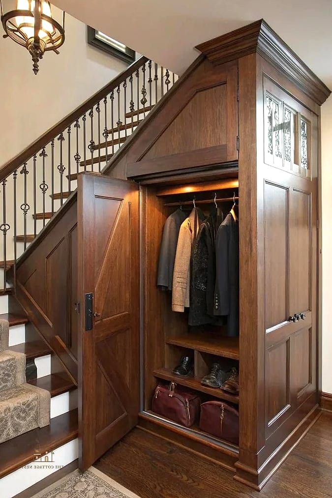 25 Gorgeous Under Stairs Ideas That Are Totally Doable 14 A Sleek Coat Closet with Slatted Doors