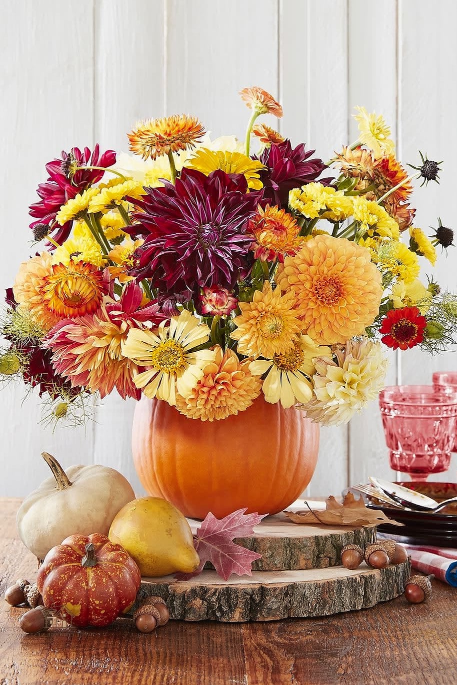 35 Beautiful Fall Table Centerpiece Ideas to Wow Your Guests 33 Squash Blossom and Candle Trio
