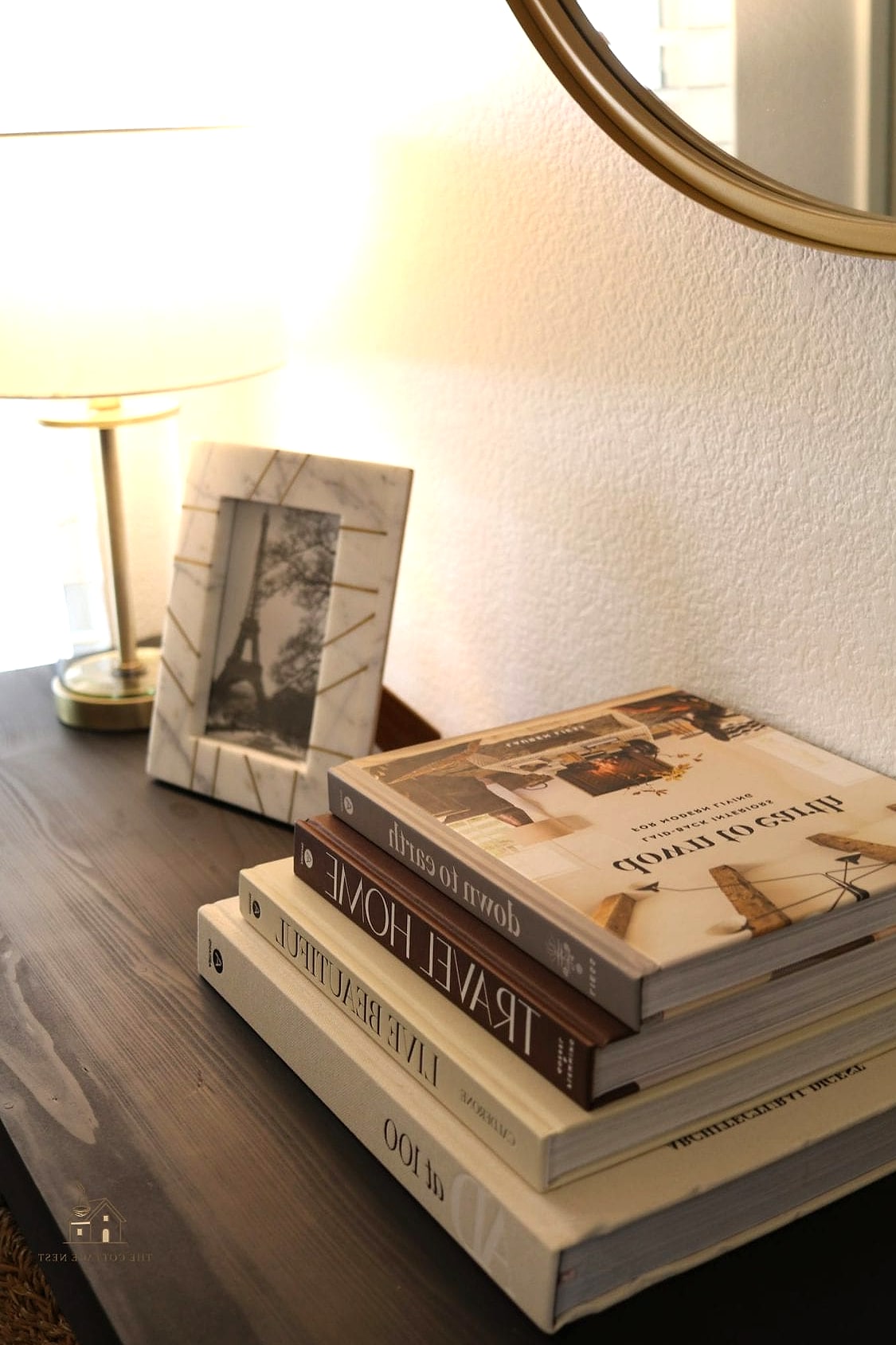 25 Chic Entryway Table Decor Ideas for a Beautiful Home 8 A Stack of Coffee Table Books
