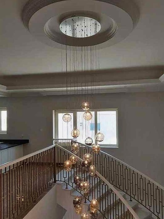35 Creative Stair Landing Decor Ideas That Will Inspire You 3 A Statement Light Fixture Overhead