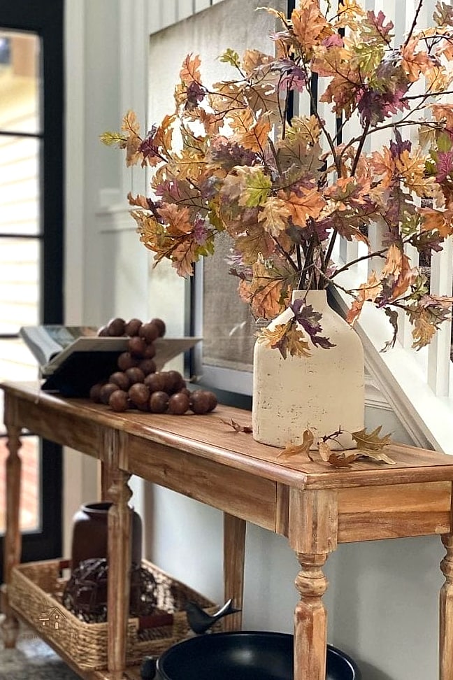 35 Creative Fall Living Room Decor That Will Inspire You 12 Style a Console Table with Pumpkins and Greenery