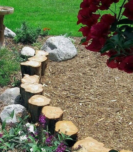 50 Beautiful Garden Border Ideas to Transform Your Space 43 Vertical Log Border