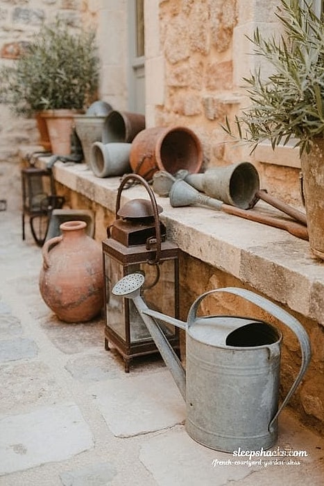 A Vintage Watering Can Display