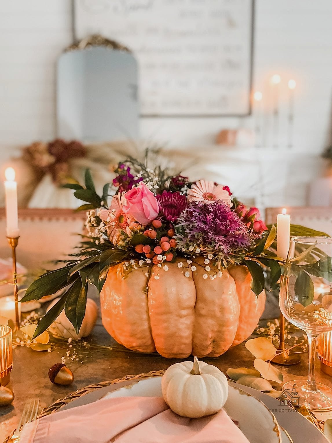 35 Beautiful Fall Table Centerpiece Ideas to Wow Your Guests 17 White Pumpkin and Eucalyptus Minimalist Look
